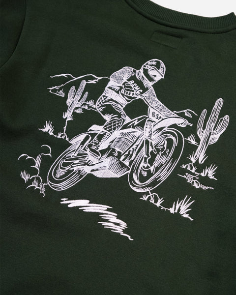 Black t-shirt with white graphic of a motorcycle rider and cacti on a plain background