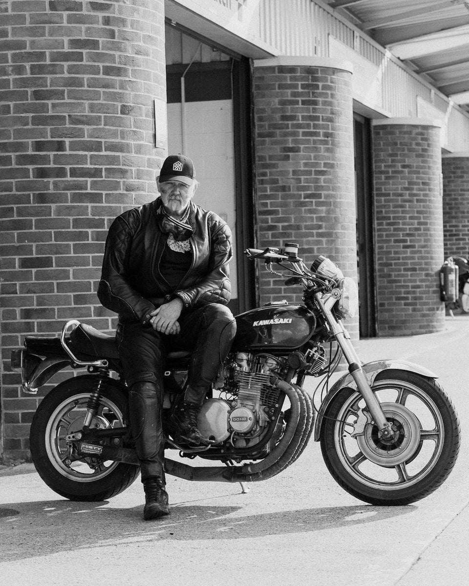 BSMC Moto Club Cap - Black worn by model sitting on motorcycle